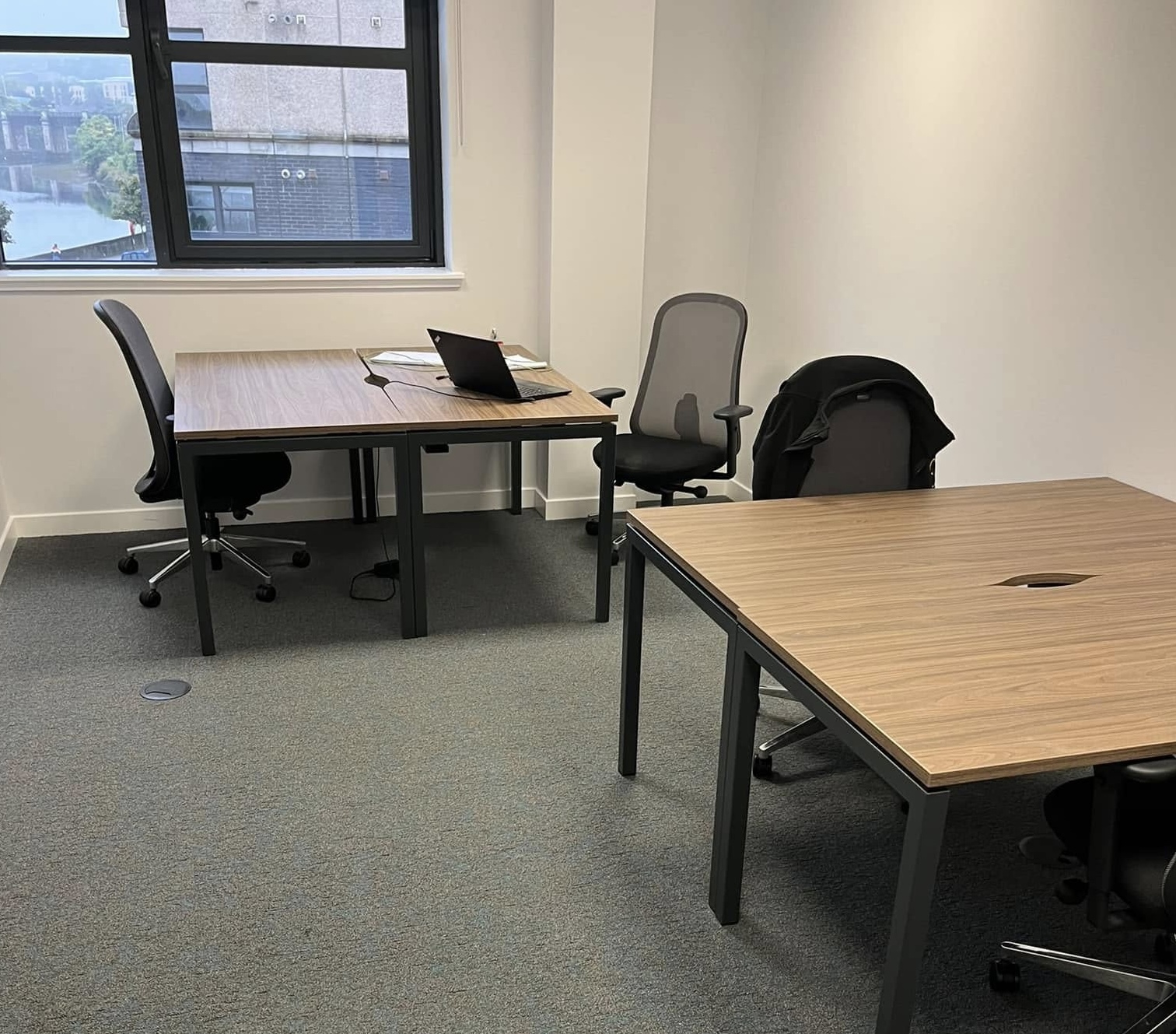 An office with desks and chairs